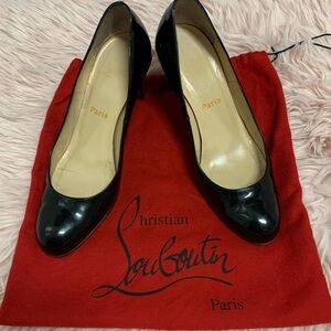Christian Louboutin Black Patent Leather Pumps.